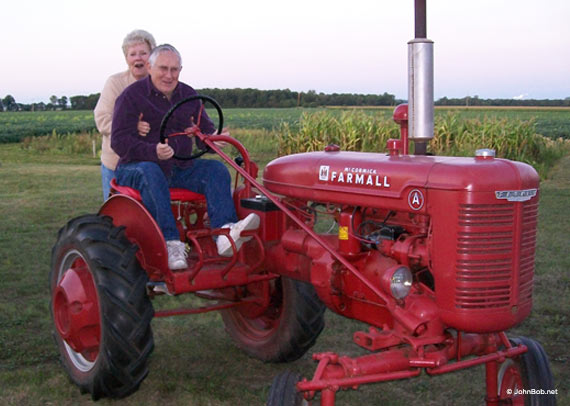 Jerry / Geraldine Lucas on Farmall tractor