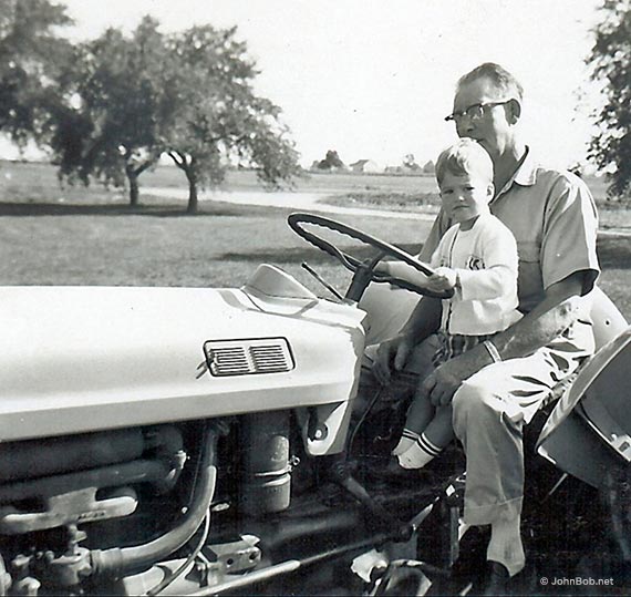 man and child on ford tractor