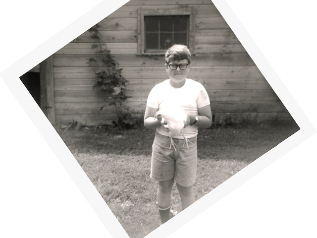 boy holding chicken