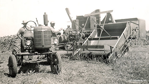 Farmall A pulling Allis Chalmers combine 1953
